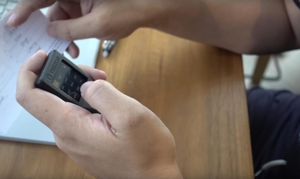 Trezor Model T thumb for scale